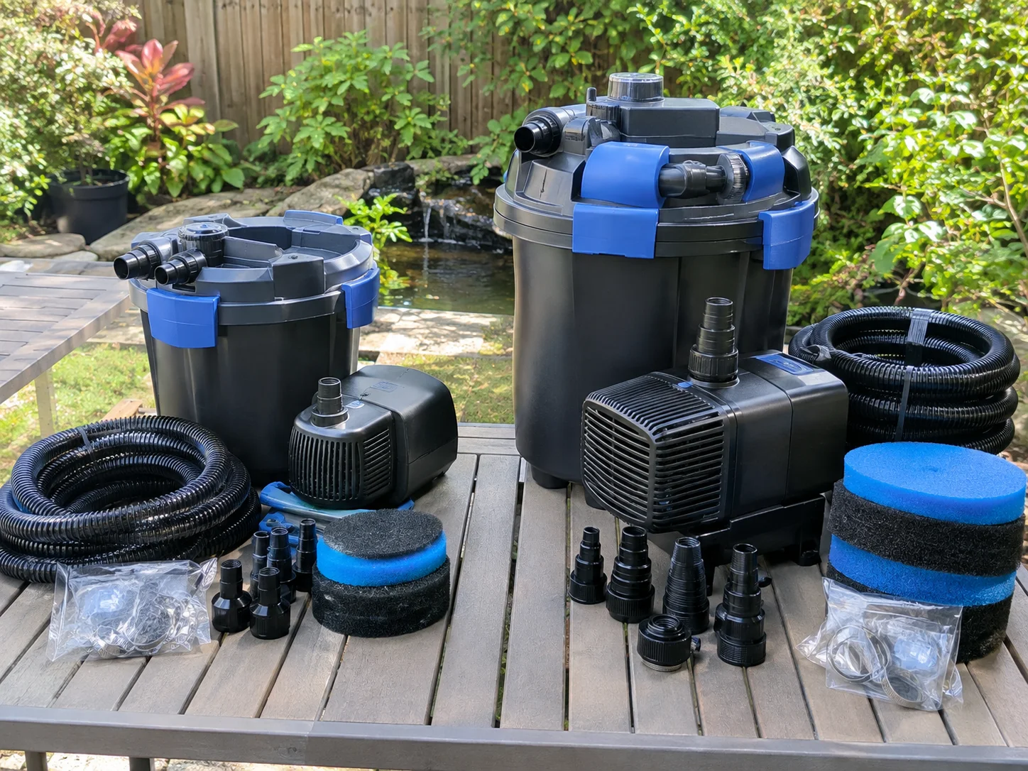 Koi Pond Kits: Types, Sizing, and Top Picks 11 Two different sized koi pond filter and pump kits side by side